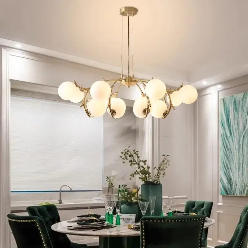 Gold-toned DecorBites LED chandelier pendant with frosted glass globes in a branching design for living room lighting