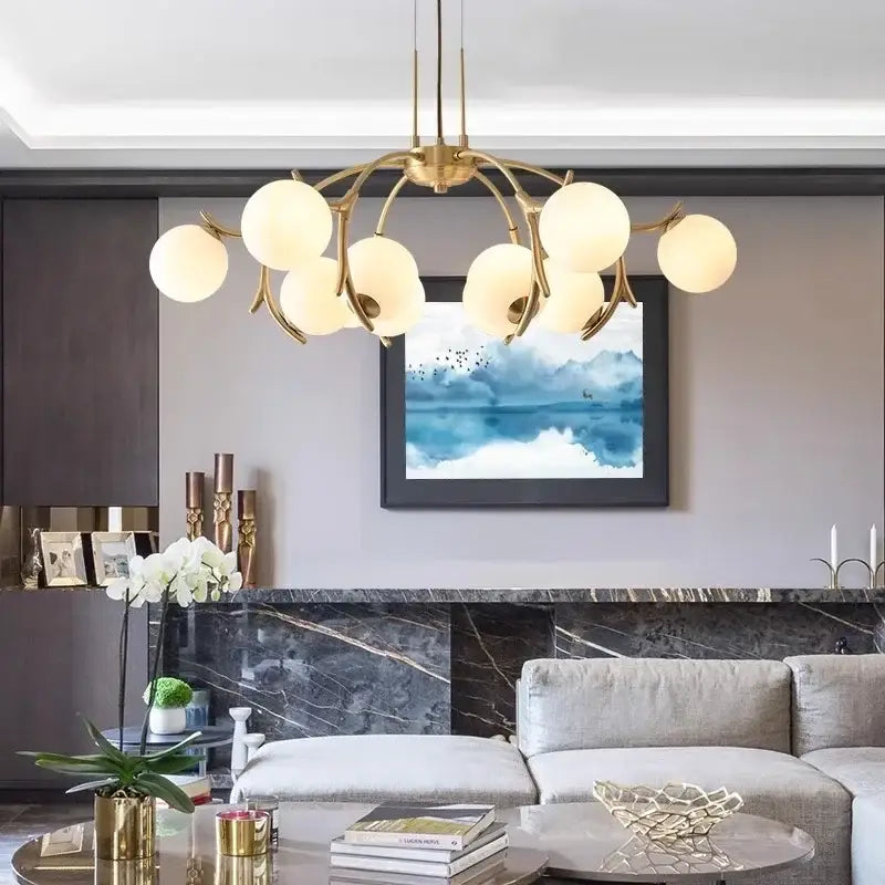 Gold-toned decorbites led chandelier pendant lamp with frosted glass globe shades for living room lighting