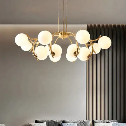 Gold-toned decorbites led chandelier pendant lamp with frosted glass globe bulbs in a branching design for living spaces