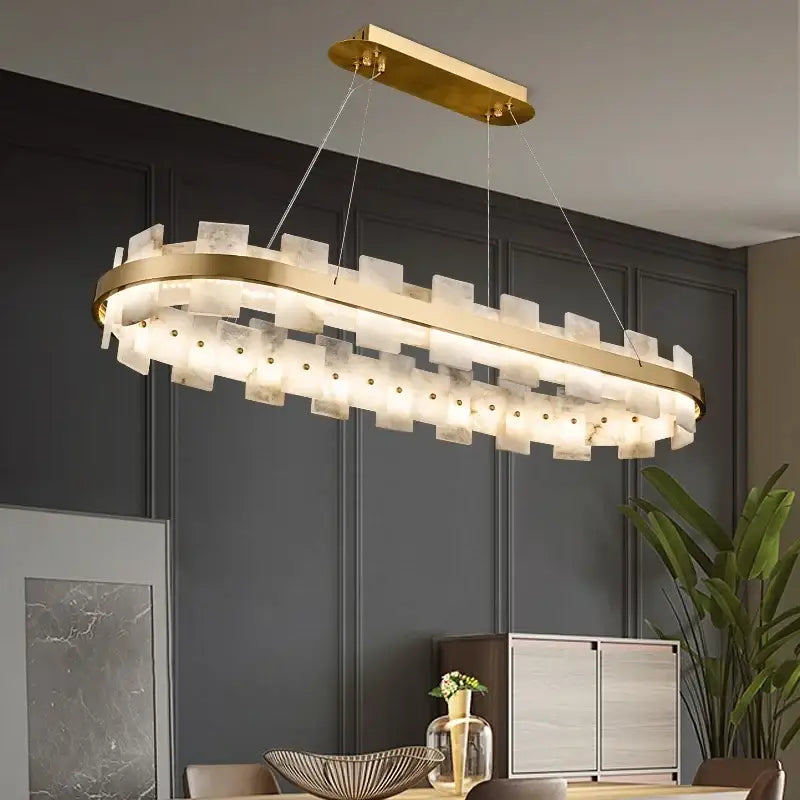 Gold-toned decorbites led chandelier with layered translucent white marble-like panels for bedroom and living room decor