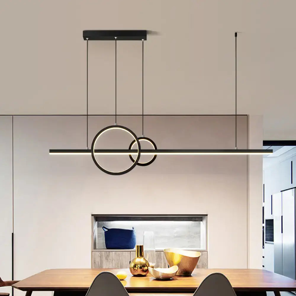 Modern black circular metal pendant light with sleek minimalist design and thin cords for warm white third gear ambiance