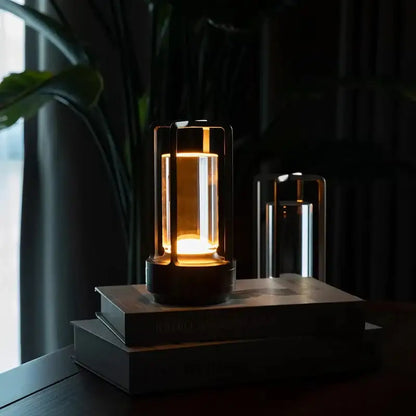Decorbites™ led crystal table lamp with warm-toned glass and black metal frame emitting soft ambient light