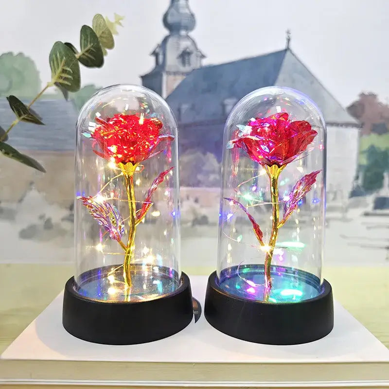 Two illuminated red metallic roses in glass domes with black bases decorbites™ eternal rose light for valentine’s day and weddings