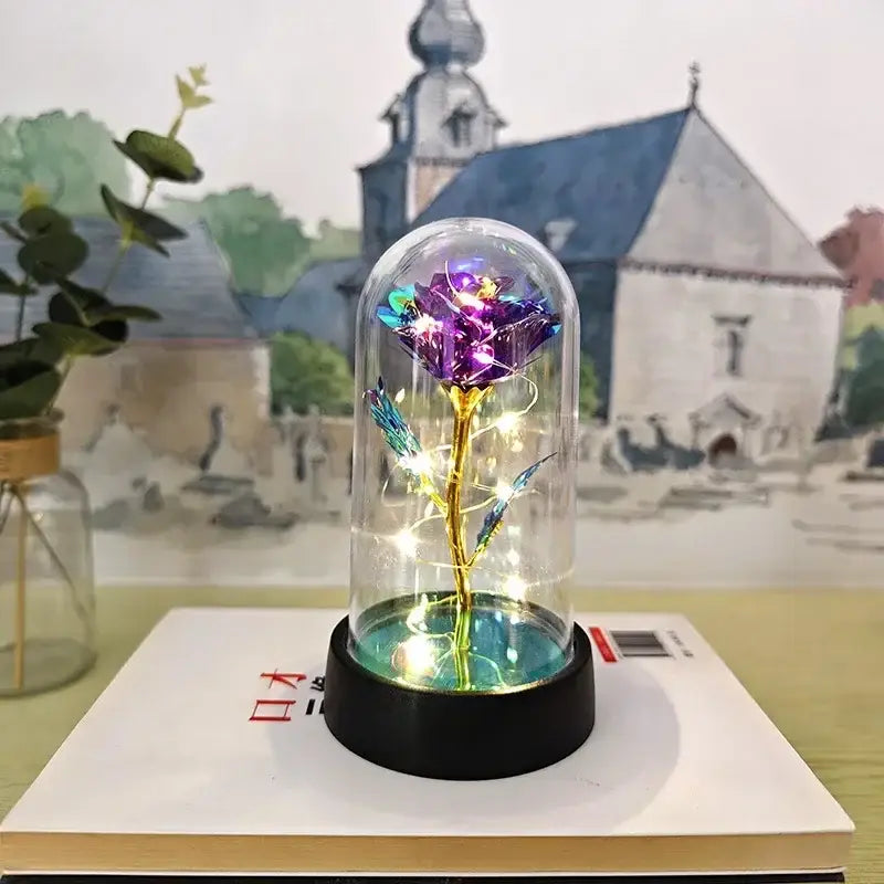 Decorbites™ led eternal rose light featuring a glowing purple eternal rose with gold stem under a glass dome