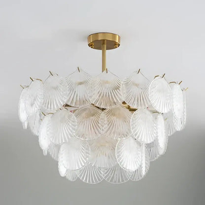 Clear glass shell chandelier with gold-toned metal frame featuring decorbites led frost glass shell design for home decor