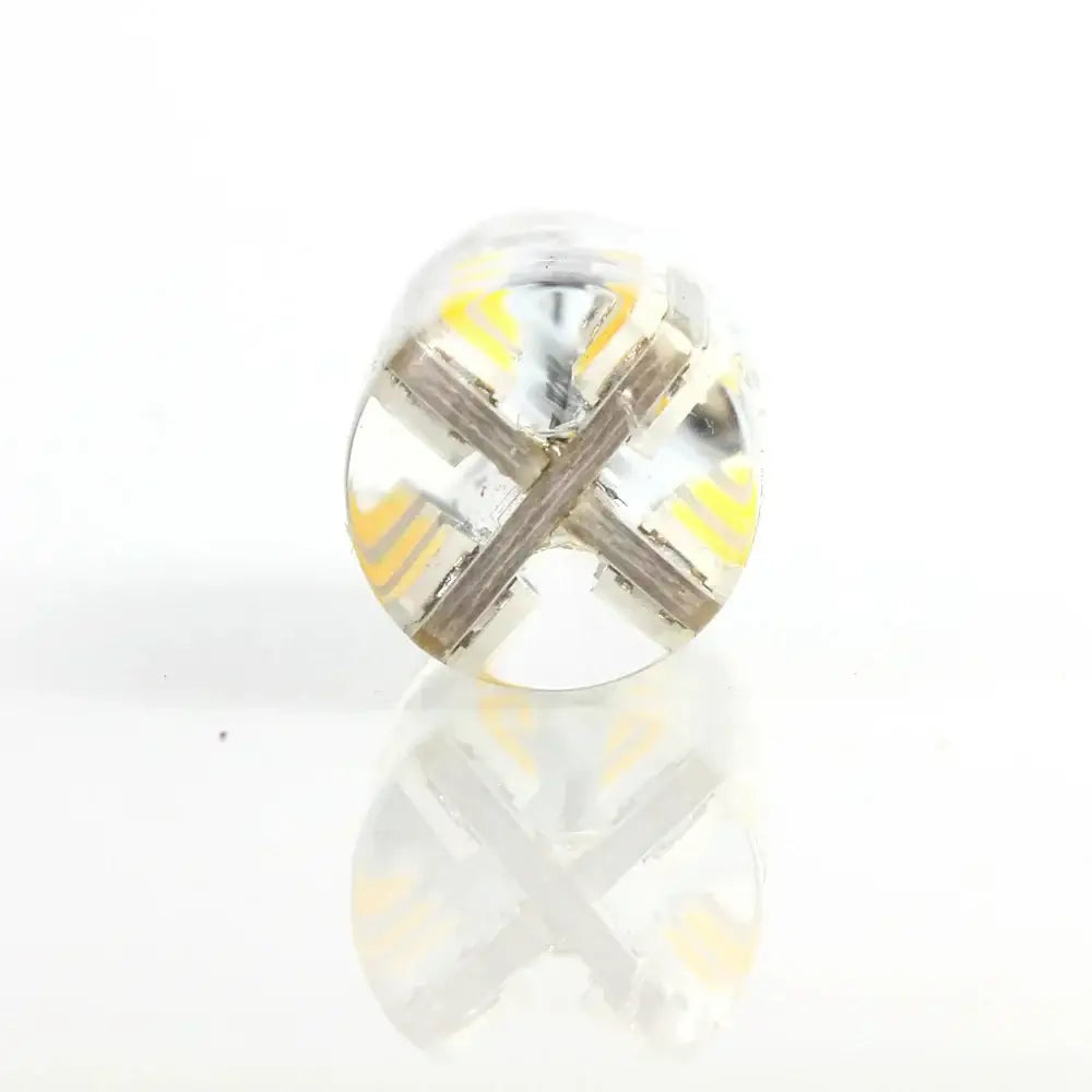 Clear round DecorBites led G4 3W bulb with transparent casing showing yellow and silver internal circuitry for spotlight use