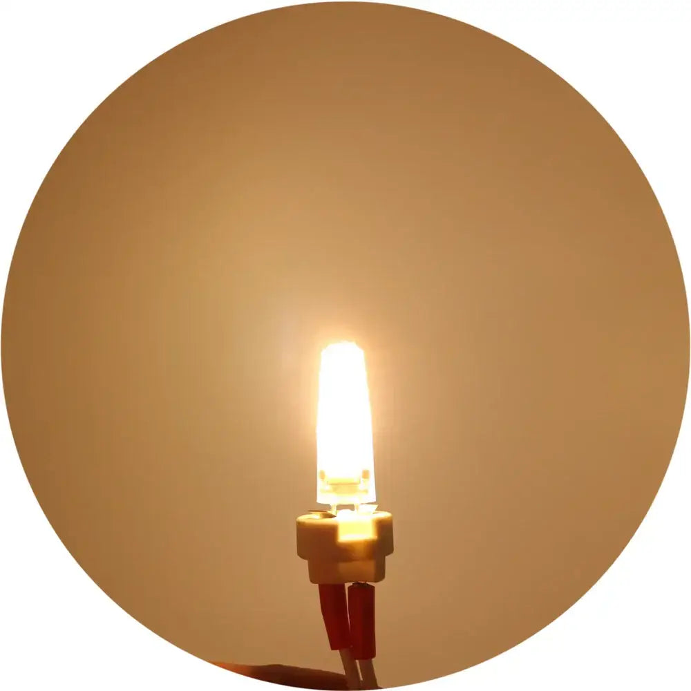 Warm white led g4 bulb by decorbites with compact cylindrical glass body and metallic base halogen 25w replacement