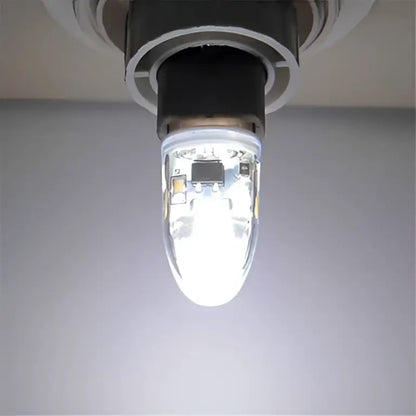 A clear glass decorbites led g9 bulb with visible circuit board emitting white light for efficient lighting solution