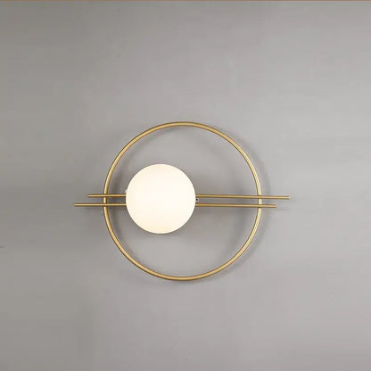 Modern gold-toned decorbites led g9 wall sconce with circular frame and off-white spherical glass shade for indoor lighting