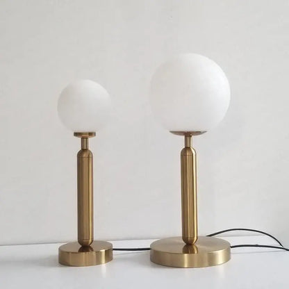 Two minimalist brass table lamps with frosted white glass shades from decorbites led glass ball collection for luxury decor