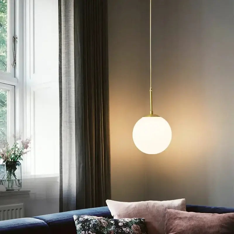 Minimalist decorbites led glass ball chandelier with spherical frosted glass shade and brass rod for modern dining rooms