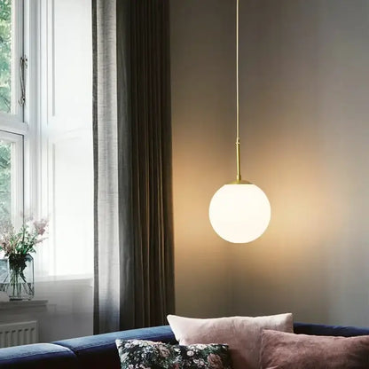 Minimalist decorbites led glass ball chandelier with spherical frosted glass shade and brass rod for modern dining rooms