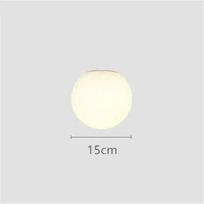 A sleek decorbites led glass ball wall sconce 15cm diameter with matte finish and soft diffused white glow