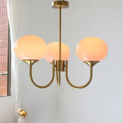 Brass-finished decorbites led glass balls chandeliers with warm translucent orange glass globes for home decor