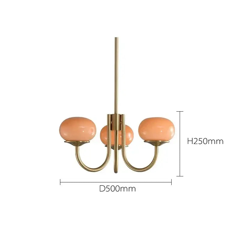 A brass-finished decorbites led glass chandelier with three peach glass balls for elegant home lighting