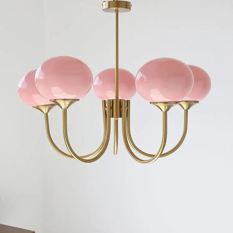 A delicate brass decorbites led glass chandelier with five translucent pink glass balls shades for home decor
