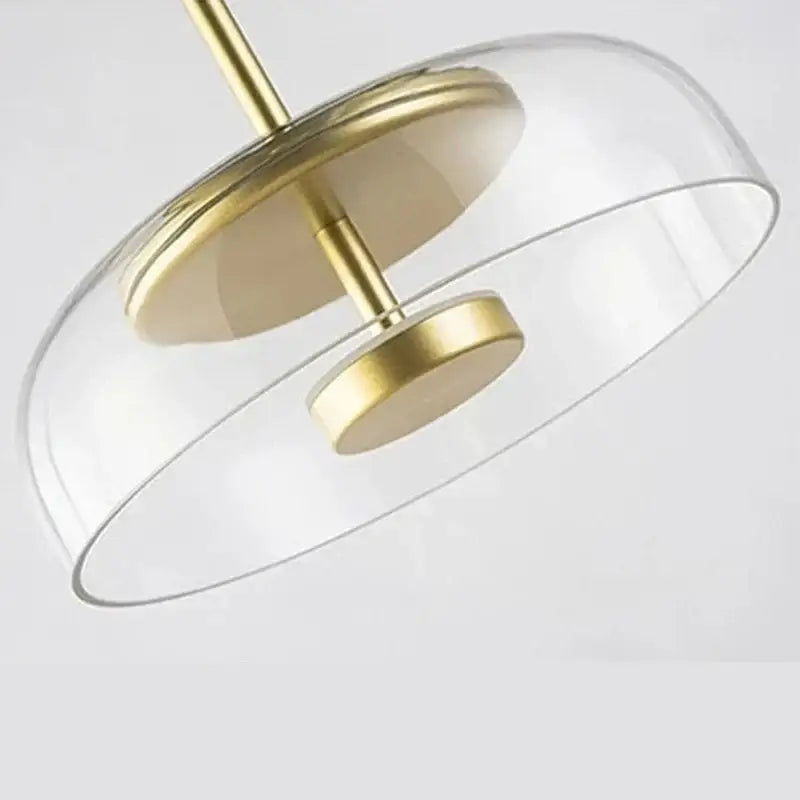 Modern decorbites led glass pendant light with sleek brass metal frame and transparent glass dome for home lighting