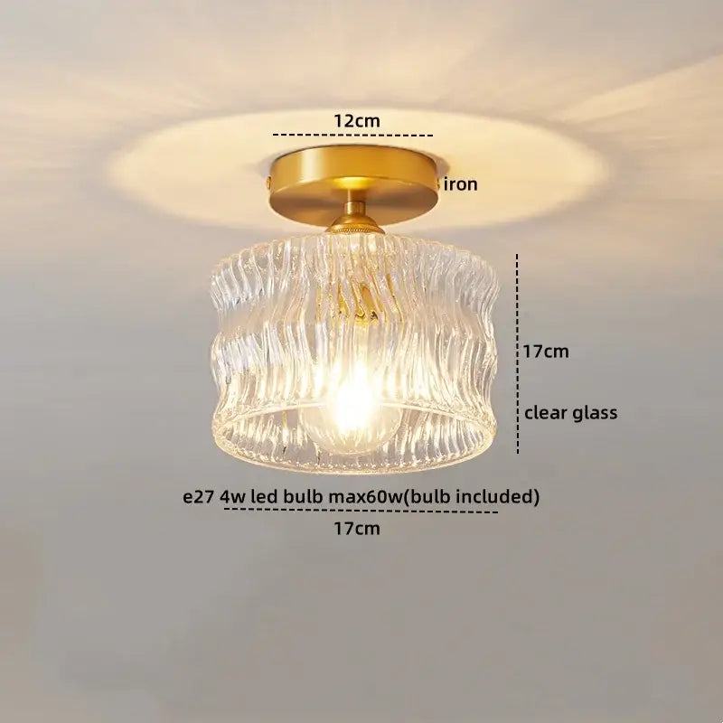 A decorbites led glass ceiling lamp with a clear ribbed glass shade, brass iron base, and included e27 led bulb