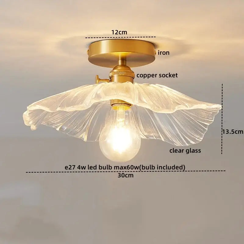 A decorbites led glass ceiling lamp featuring a delicate clear glass shade with fluted design on an antique brass base