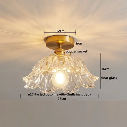 A delicate decorbites led glass ceiling lamp with clear glass, brass iron base, and copper socket for interior decor