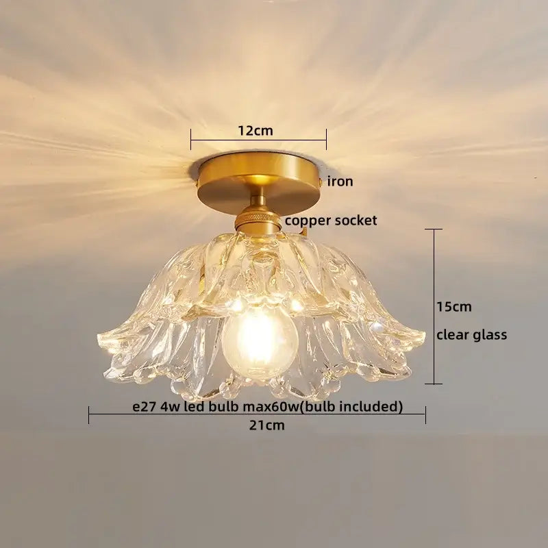 A delicate decorbites led glass ceiling lamp with clear glass pendant, brass iron base, and copper socket for interior decor