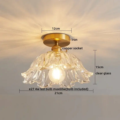 A delicate decorbites led glass ceiling lamp with clear glass pendant, brass iron base, and copper socket for interior decor