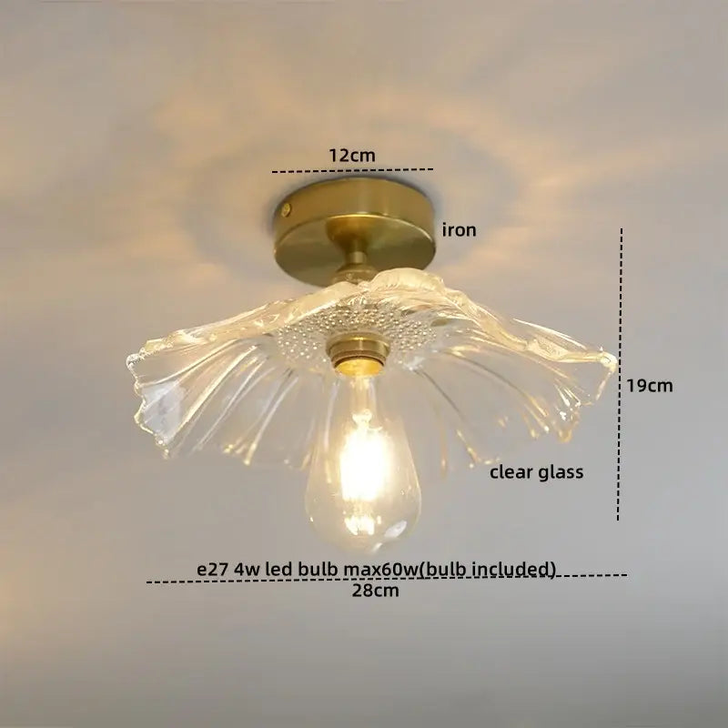 DecorBites™ modern glass ceiling lamp with clear glass shade, brass iron base, and petal-like design featuring exposed bulb