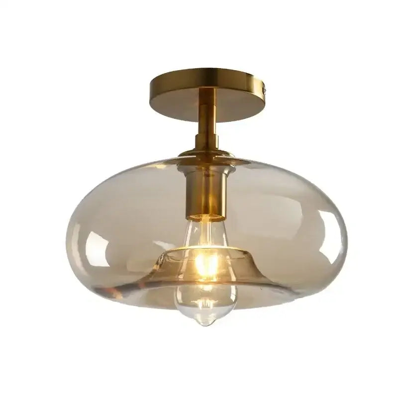 Modern DecorBites™ LED glass ceiling light with brass finish and amber glass globe for contemporary spaces