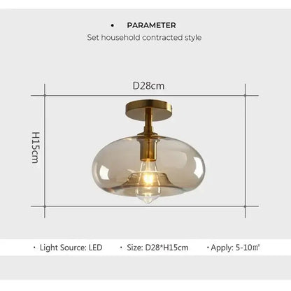 A modern frosted glass pendant ceiling light with brass fixture and exposed led bulb from decorbites led glass ceiling collection