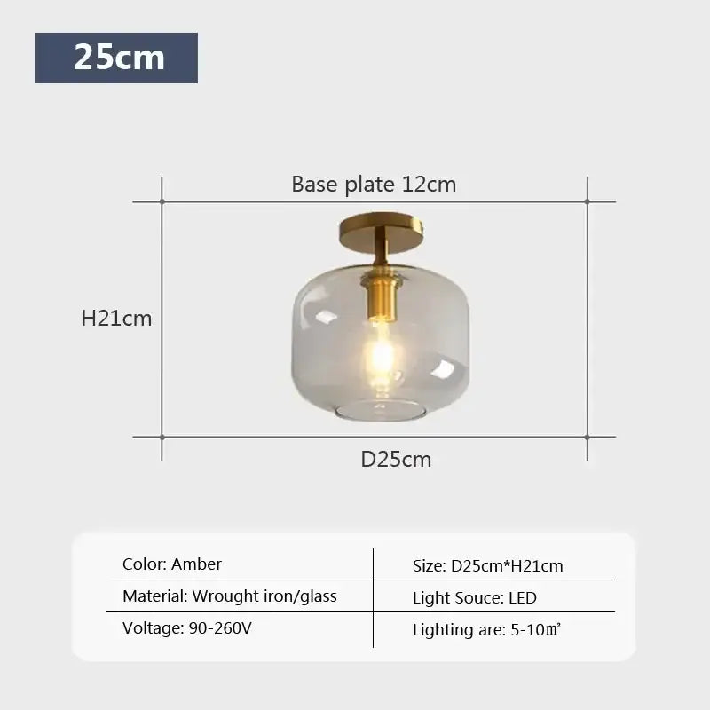 Amber-colored decorbites led glass ceiling light with frosted globe and brass wrought iron base for modern spaces