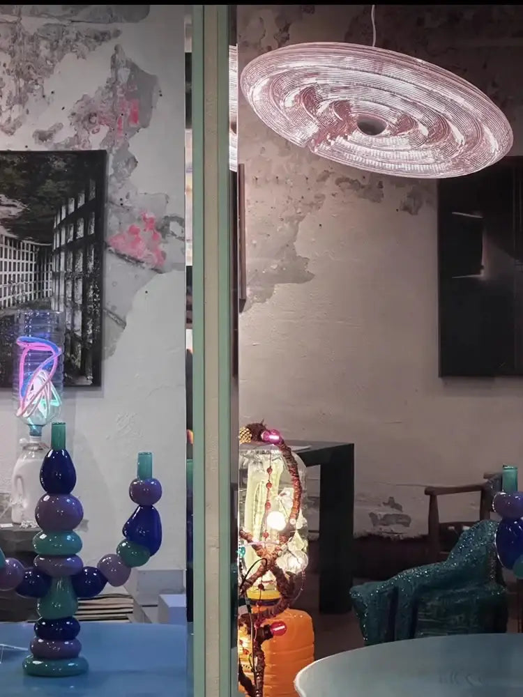 A translucent pink spiral pendant decorbites led glass chandelier with modern round ceiling holder for dining room lighting