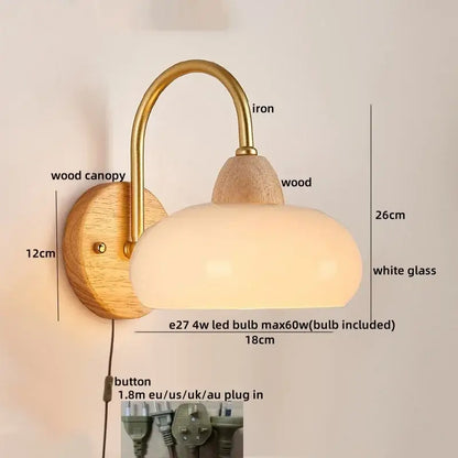 Decorbites™ modern nordic wall light fixture with brass iron arm, wooden base, and oval white glass shade in warm tone