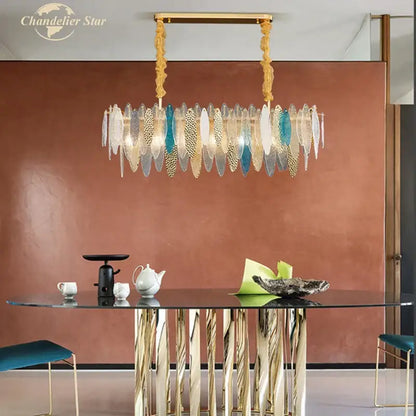 A decorbites led glass metal chandelier with gold frame and layered translucent white teal glass metal leaf plates for home decor