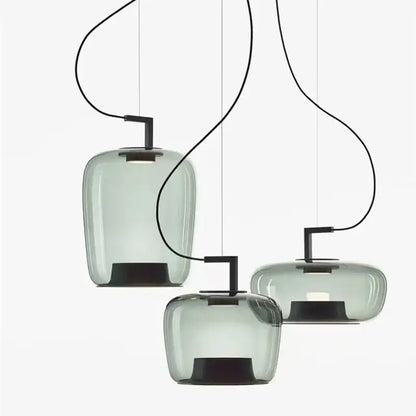 Three modern decorbites led glass pendant chandelier with translucent gray glass shades and black metal fixtures