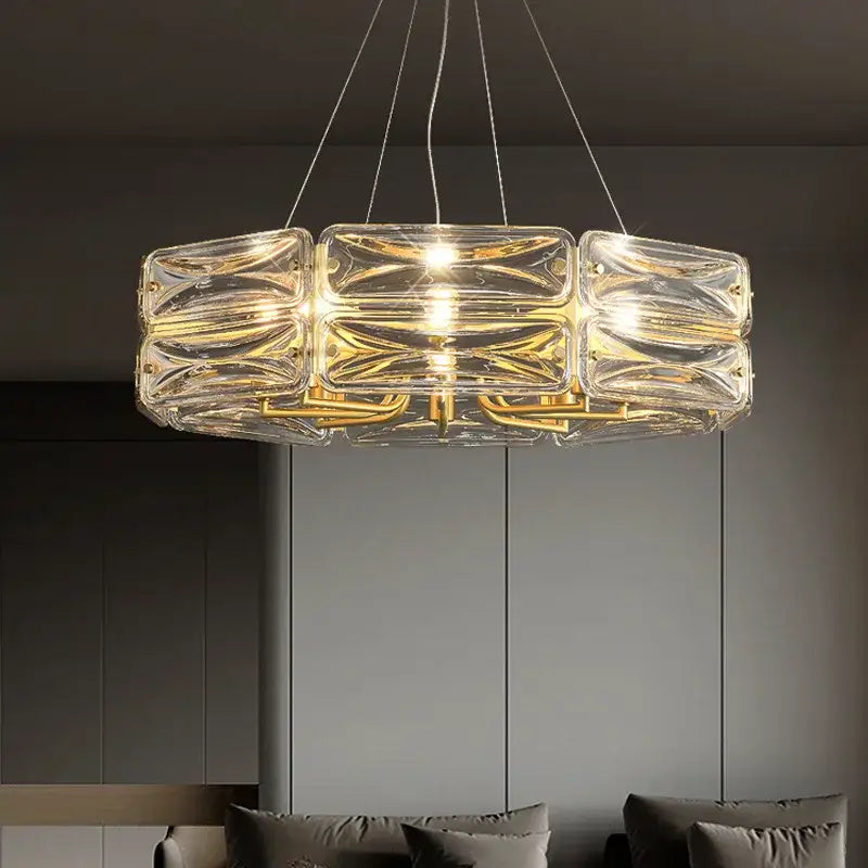 Clear glass decorbites led glass pendant light with gold-toned metal accents and modern geometric design for kitchen island
