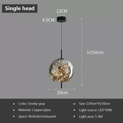 Smokey gray decorbites led glass pendant light with copper and glass featuring illuminated golden filaments inside globe