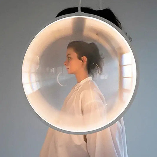 A sleek circular DecorBites led glass pendant light with translucent dome and metallic frame for hall or living room