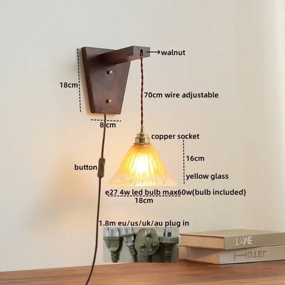 A warm yellow glass pendant wall lamp with walnut mount and copper socket featuring an adjustable 70cm wire from decorbites led glass sconce