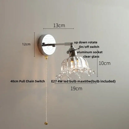 Clear glass chandelier-style decorbites led glass wall light with polished chrome finish and adjustable arm for bedside use