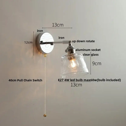 Industrial-style decorbites led glass wall light with polished iron base, adjustable arm, and clear textured glass shade