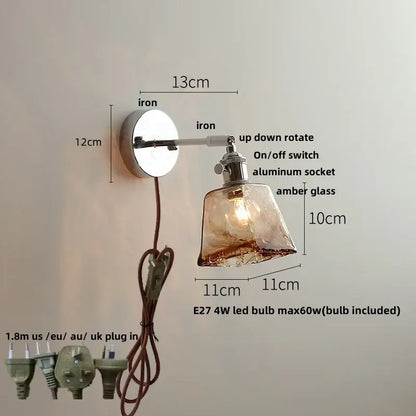 A sleek amber glass wall light with polished iron base and adjustable arm from decorbites led glass wall collection
