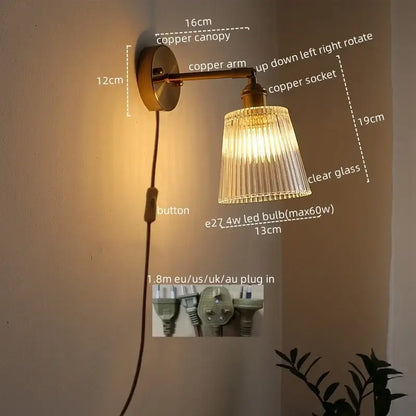 Copper-finished DecorBites LED glass wall lights with clear ribbed glass shade and adjustable arm for modern decor