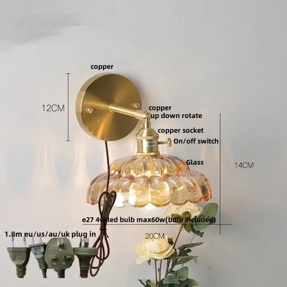 Decorbites led glass wall light with brass-finished copper sconce, faceted amber glass shade, and adjustable arm