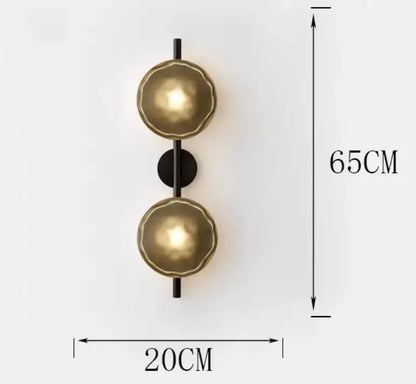 Gold-toned textured spherical wall sconce with black rod and plate decorbites led glass wall sconce for living room lighting