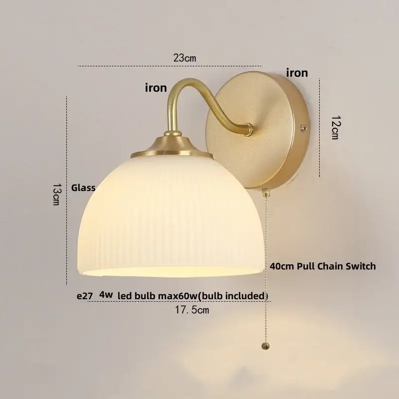 Vintage-style brass decorbites led glass wall sconce with frosted vertical ridged glass shade and pull chain switch