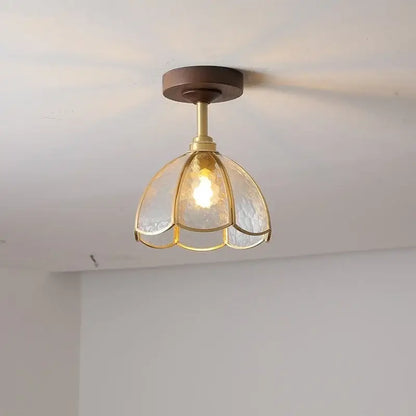 A warm-toned brass and textured glass decorbites led glass wood ceiling lamp with a petal-shaped design for modern indoor lighting