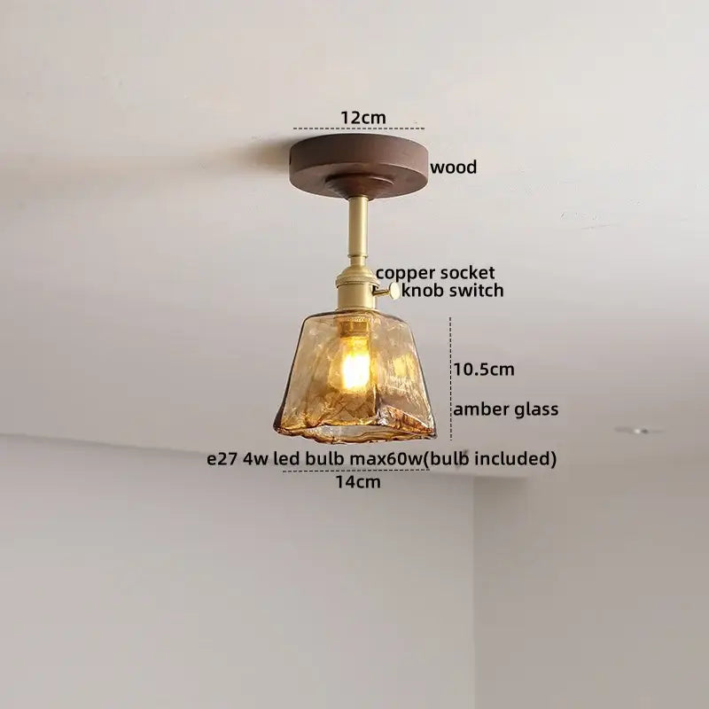 A warm amber glass ceiling lamp with copper socket and wooden mount by DecorBites LED glass wood for modern lighting