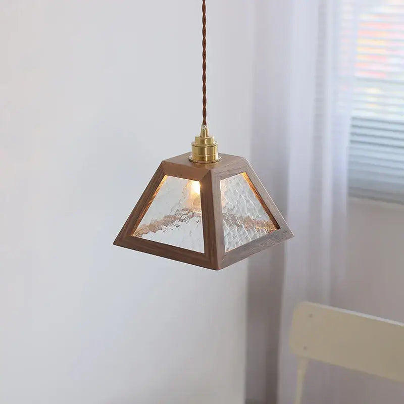 A warm-toned pyramid-shaped decorbites led pendant light with wooden frame and textured glass for coffee living room