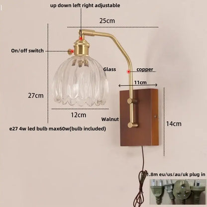 Brass-finished adjustable DecorBites LED wall sconce with clear glass shade on walnut wood base for living room use