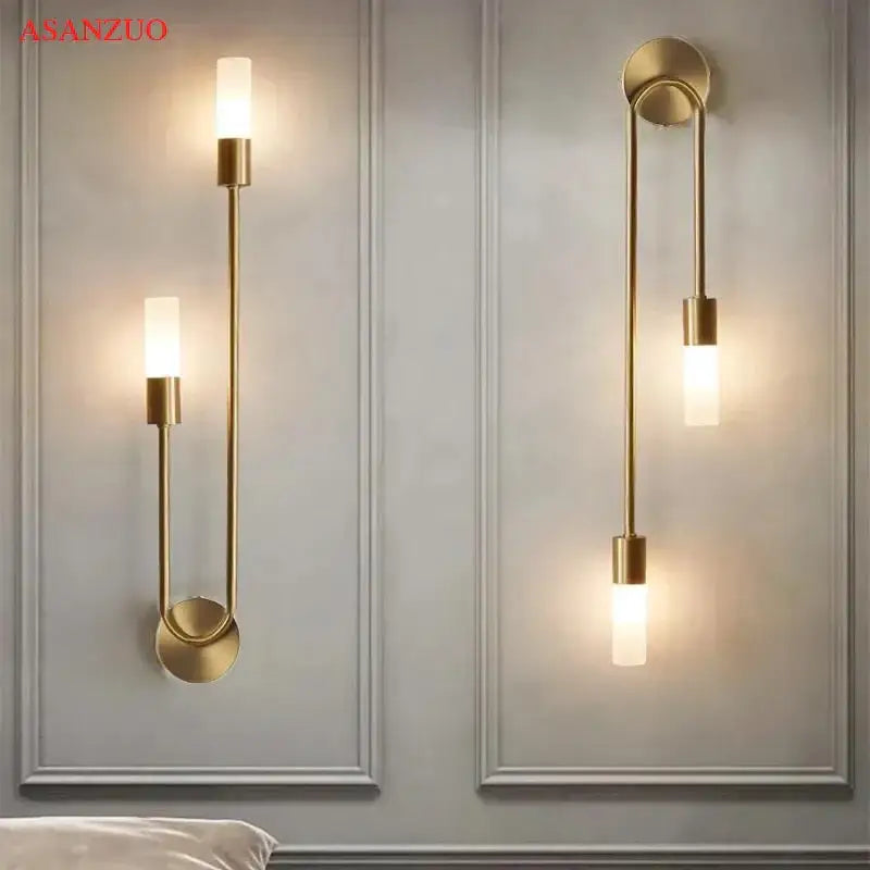 Gold-toned minimalist DecorBites LED candlestick wall light with frosted glass shades for indoor ambiance decor